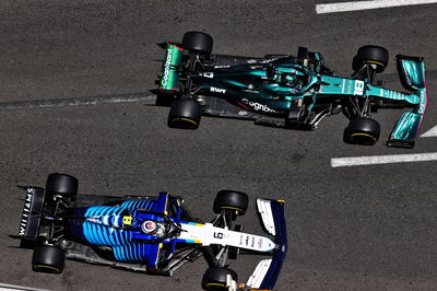 Lance Stroll (CDN) Aston Martin F1 Team AMR21 and Nicholas Latifi (CDN) Williams Racing FW43B.