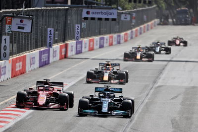 (L to R): Charles Leclerc (MON) Ferrari SF-21 and Lewis Hamilton (GBR) Mercedes AMG F1 W12 battle for position.