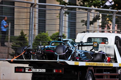 The Aston Martin F1 Team AMR21 of Lance Stroll (CDN) Aston Martin F1 Team is recovered back to the pits on the back of a truck after he crashed out of the race.