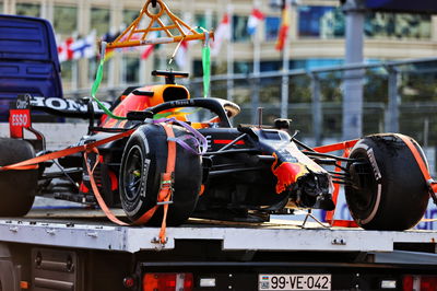 The Red Bull Racing RB16B of race retiree Max Verstappen (NLD) Red Bull Racing is recovered back to the pits on the back of a truck.