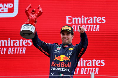 Sergio Perez (MEX) Red Bull Racing celebrates his third position on the podium.