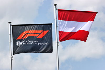 Circuit atmosphere - F1 and Austria flags.