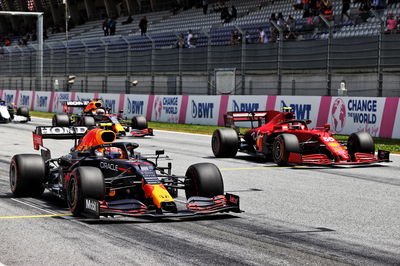 Sergio Perez (MEX) Red Bull Racing RB16B and Carlos Sainz Jr (ESP) Ferrari SF-21 - practice starts.