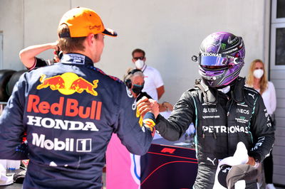 (L to R): Max Verstappen (NLD) Red Bull Racing celebrates his pole position in qualifying parc ferme with Lewis Hamilton (GBR) Mercedes AMG F1.