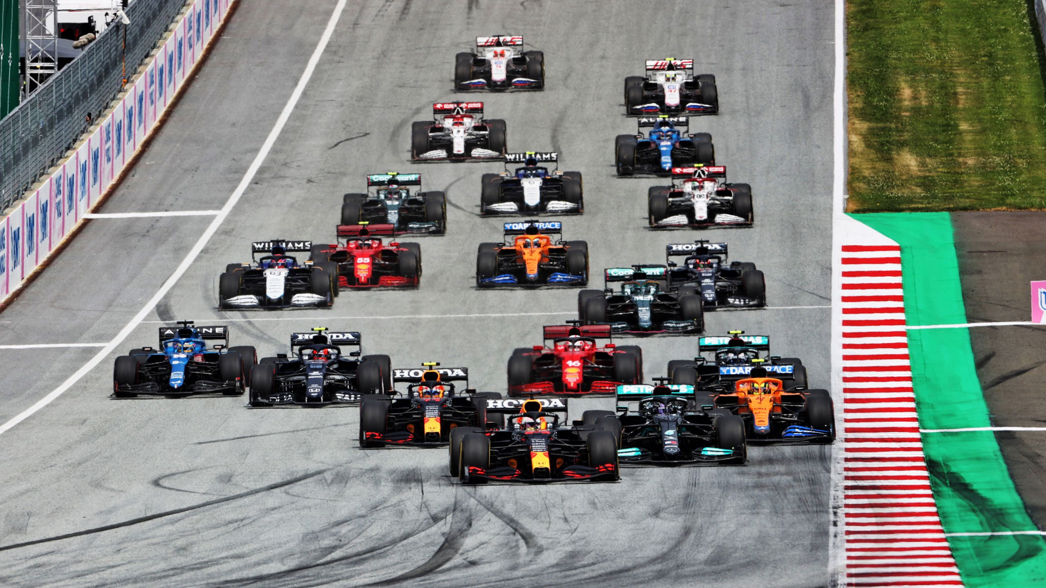 Max Verstappen (NLD) Red Bull Racing RB16B leads at the start of the race.