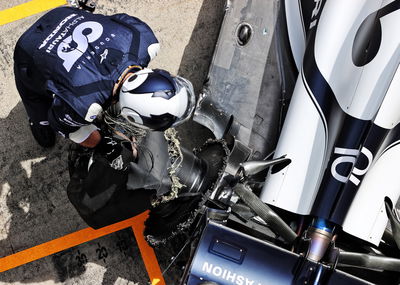 Pierre Gasly (FRA) AlphaTauri AT02 in the pits with damaged rear suspension and wheel at the start of the race.