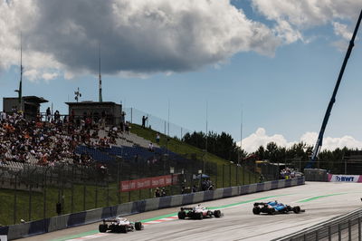 Esteban Ocon (FRA) Alpine F1 Team A521 leads Nikita Mazepin (RUS) Haas F1 Team VF-21 and Mick Schumacher (GER) Haas VF-21.