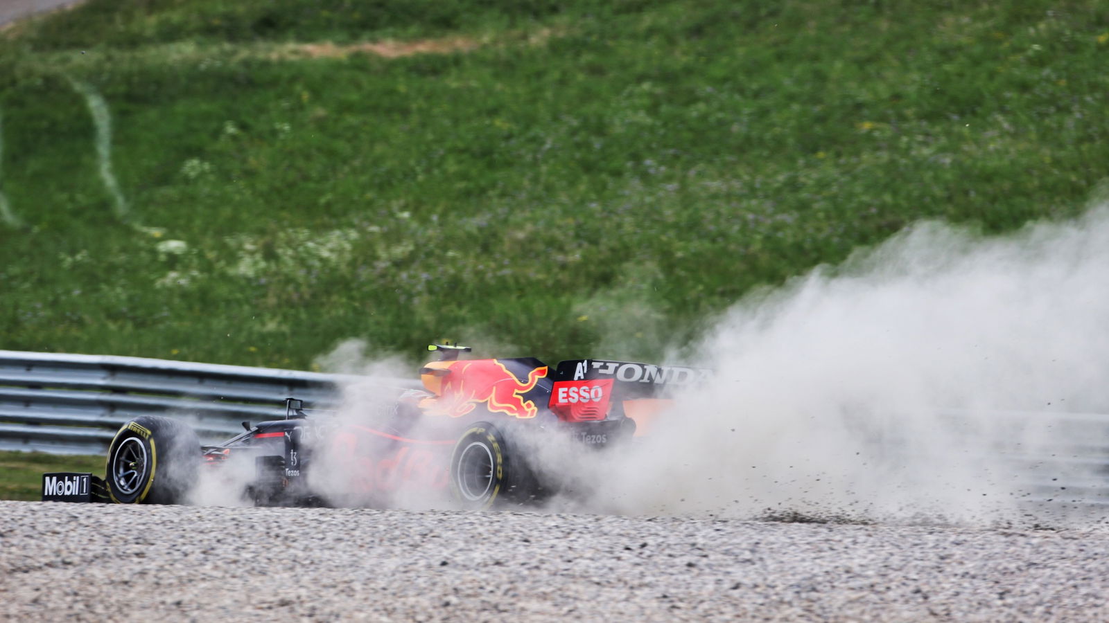 Sergio Perez (MEX) Red Bull Racing RB16B runs wide.