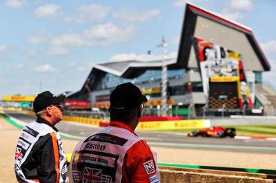 Circuit atmosphere - marshals trackside watch the action.