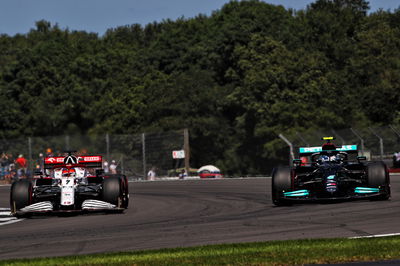 Kimi Raikkonen (FIN) Alfa Romeo Racing C41 and Valtteri Bottas (FIN) Mercedes AMG F1 W12.