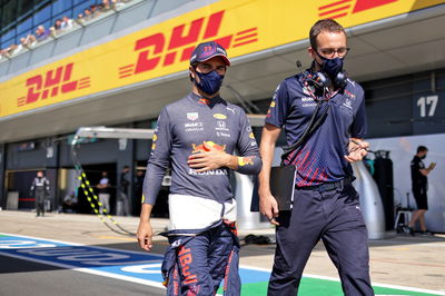 Sergio Perez (MEX) Red Bull Racing on the grid.