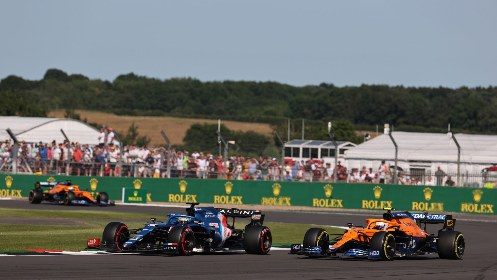 Fernando Alonso (ESP) Alpine F1 Team A521 and Daniel Ricciardo (AUS) McLaren MCL35M.