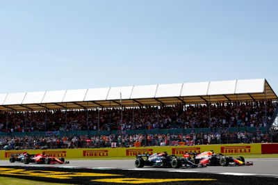 Max Verstappen (NLD) Red Bull Racing RB16B and Lewis Hamilton (GBR) Mercedes AMG F1 W12 battle for the lead at the start of the race.