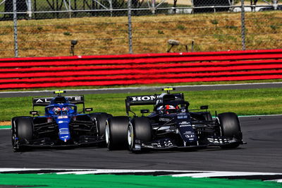 Esteban Ocon (FRA) Alpine F1 Team A521 and Pierre Gasly (FRA) AlphaTauri AT02 battle for position.