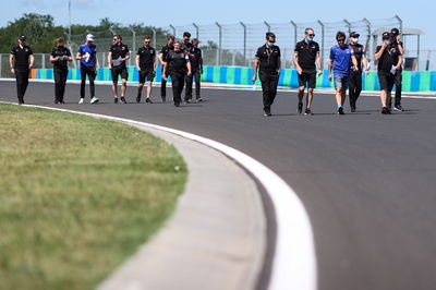 Fernando Alonso (ESP) Alpine F1 Team and Esteban Ocon (FRA) Alpine F1 Team walk the circuit with the team.