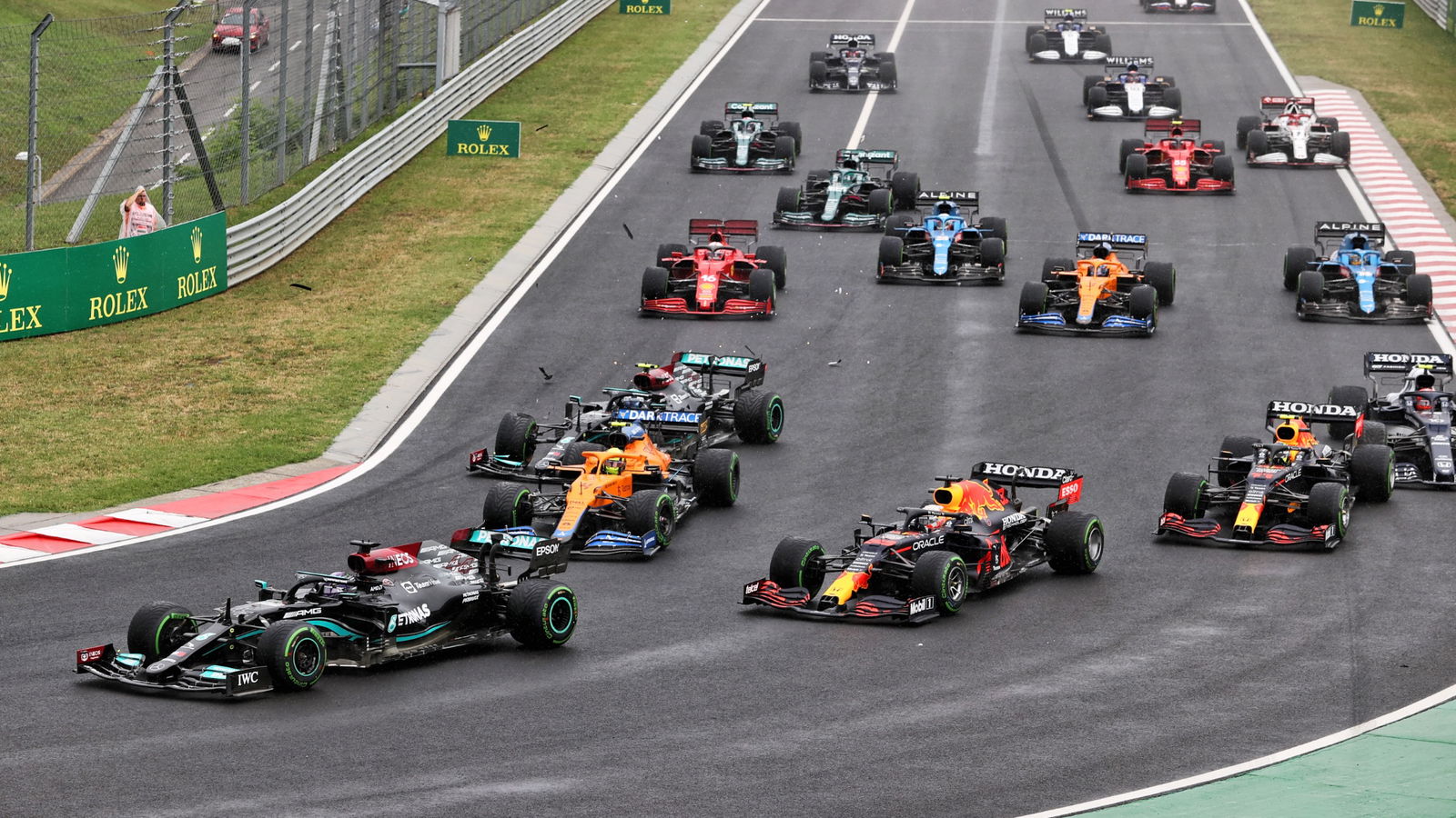 Lewis Hamilton (GBR) Mercedes AMG F1 W12 leads at the start of the race as Valtteri Bottas (FIN) Mercedes AMG F1 W12 crashes into the back of Lando Norris (GBR) McLaren MCL35M.