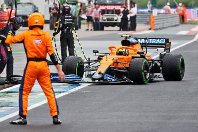 Lando Norris (GBR) McLaren MCL35M makes a pit stop.