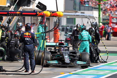 Lewis Hamilton (GBR) Mercedes AMG F1 W12 makes a pit stop.