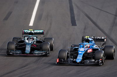 Esteban Ocon (FRA) Alpine F1 Team A521 and Sebastian Vettel (GER) Aston Martin F1 Team AMR21 battle for the lead of the race.