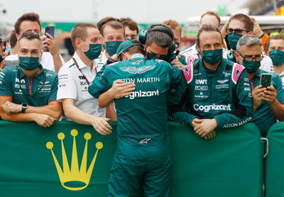 Sebastian Vettel (GER) Aston Martin F1 Team celebrates his second position in parc ferme with the team.