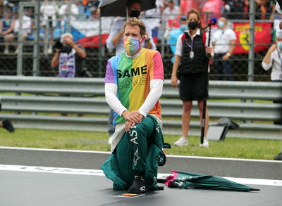 Sebastian Vettel (GER) Aston Martin F1 Team on the grid.