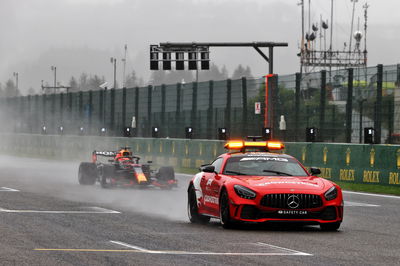 Max Verstappen (NLD) Red Bull Racing RB16B leads behind the Mercedes FIA Safety Car.