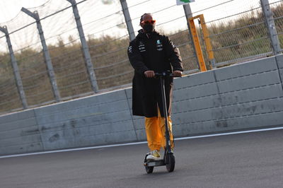 Lewis Hamilton (GBR) Mercedes AMG F1 W12 checks out the circuit on a scooter.