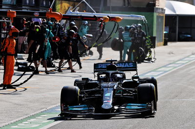 Lewis Hamilton (GBR) Mercedes AMG F1 W12 makes a pit stop.