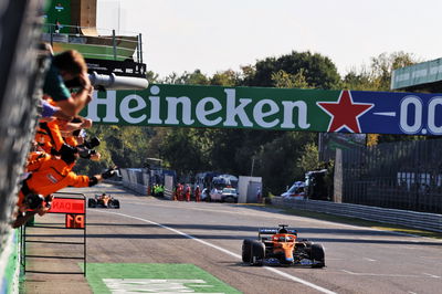 Race winner Daniel Ricciardo (AUS) McLaren MCL35M celebrates as he passes the team at the end of the race.