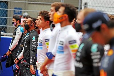 Lewis Hamilton (GBR) Mercedes AMG F1 as the grid observes the playing of Tchaikovsky.