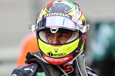 Sergio Perez (MEX) Red Bull Racing on the grid.