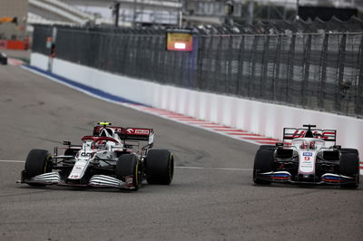 Antonio Giovinazzi (ITA) Alfa Romeo Racing C41 and Nikita Mazepin (RUS) Haas F1 Team VF-21 battle for position.