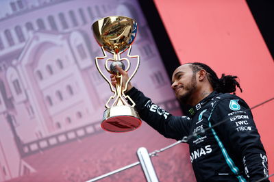 Race winner Lewis Hamilton (GBR) Mercedes AMG F1 celebrates on the podium.