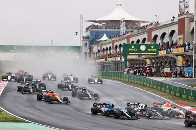 (L to R): Fernando Alonso (ESP) Alpine F1 Team A521, Pierre Gasly (FRA) AlphaTauri AT02, and Sergio Perez (MEX) Red Bull Racing RB16B at the start of the race.