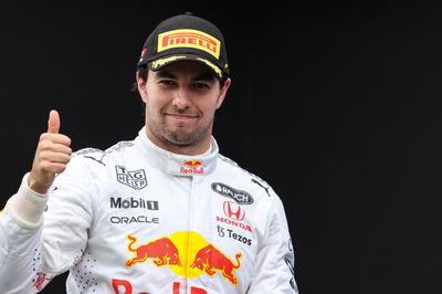 Sergio Perez (MEX) Red Bull Racing celebrates his third position on the podium.