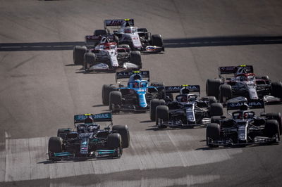 (L to R): Valtteri Bottas (FIN) Mercedes AMG F1 W12 and Yuki Tsunoda (JPN) AlphaTauri AT02 at the start of the race.