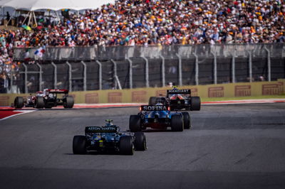 George Russell (GBR) Williams Racing FW43B leads Sebastian Vettel (GER) Aston Martin F1 Team AMR21.