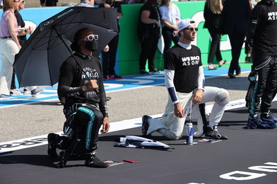 Lewis Hamilton (GBR) Mercedes AMG F1 W12 and Pierre Gasly (FRA) AlphaTauri AT02.