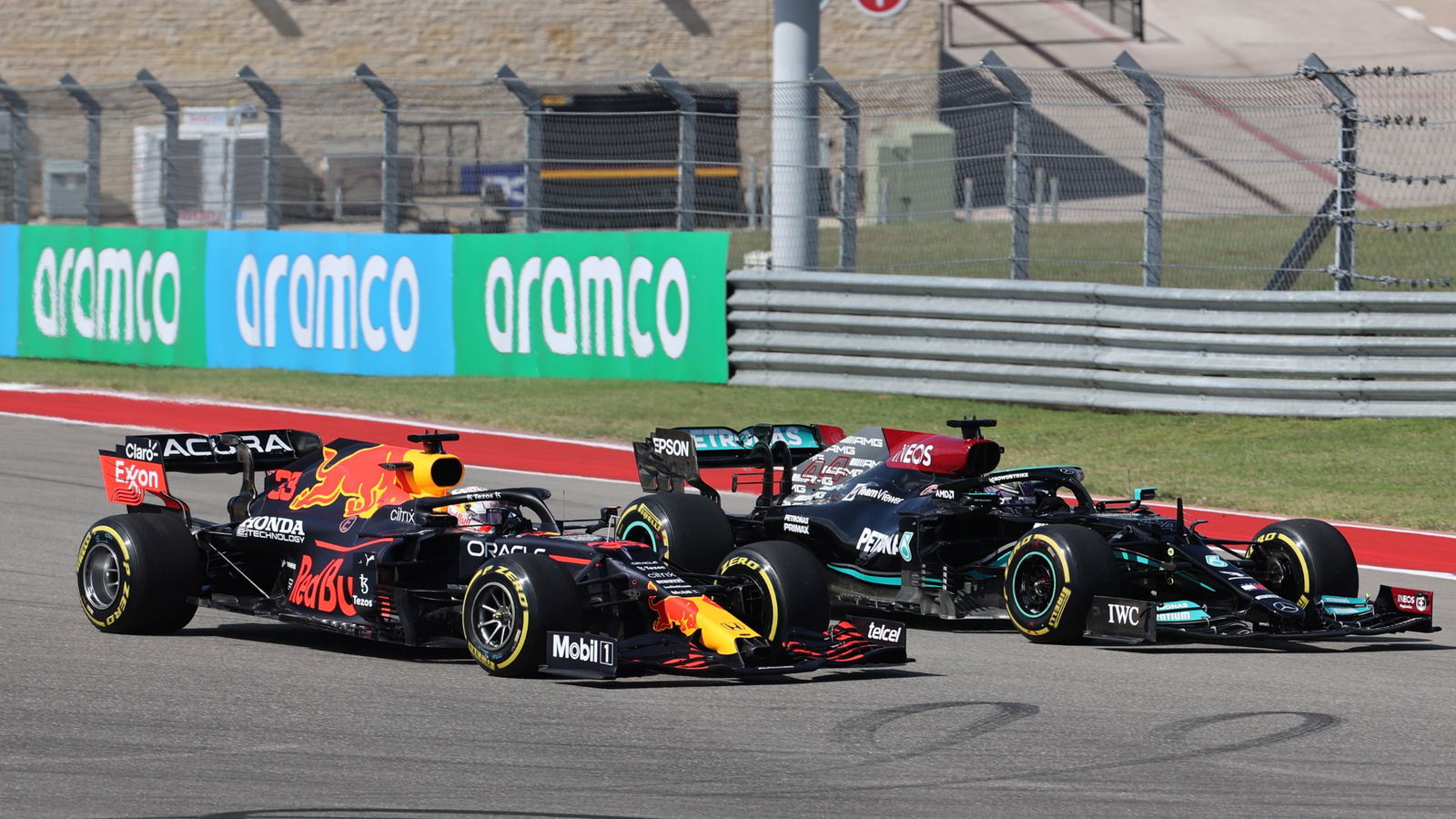 Lewis Hamilton (GBR) Mercedes AMG F1 W12 and Max Verstappen (NLD) Red Bull Racing RB16B.