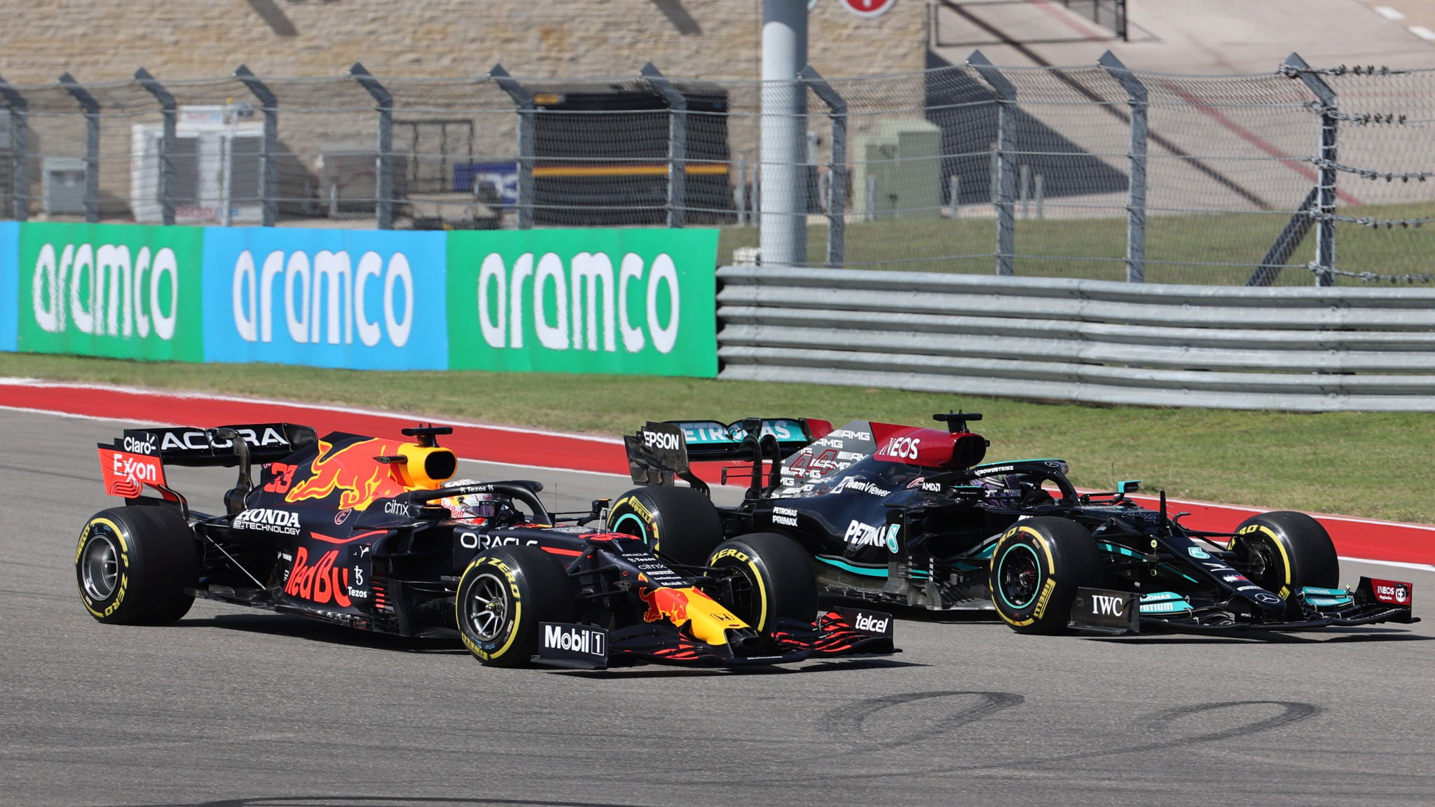 Lewis Hamilton (GBR) Mercedes AMG F1 W12 and Max Verstappen (NLD) Red Bull Racing RB16B.