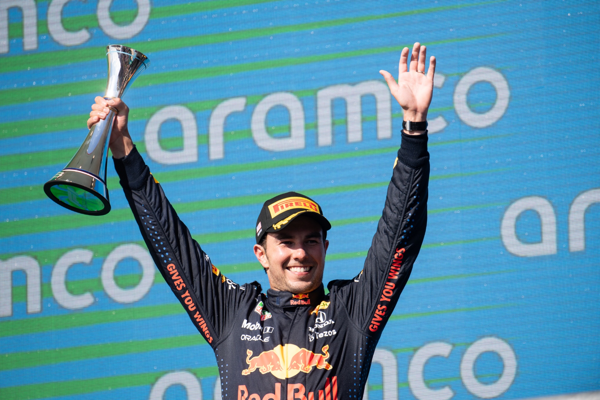 Sergio Perez (MEX) Red Bull Racing celebrates his third position on the podium.