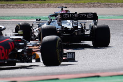 Lewis Hamilton (GBR) Mercedes AMG F1 W12 leads Max Verstappen (NLD) Red Bull Racing RB16B.