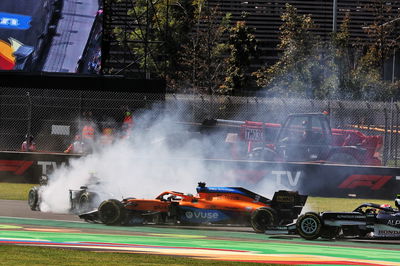 Valtteri Bottas (FIN) Mercedes AMG F1 W12 spins after being hit by Daniel Ricciardo (AUS) McLaren MCL35M at the start of the race.