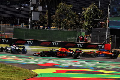 Valtteri Bottas (FIN) Mercedes AMG F1 W12 spins in front of Sergio Perez (MEX) Red Bull Racing RB16B and Daniel Ricciardo (AUS) McLaren MCL35M at the start of the race.