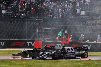 A damaged Yuki Tsunoda (JPN) AlphaTauri AT02 and Valtteri Bottas (FIN) Mercedes AMG F1 W12 at the start of the race.