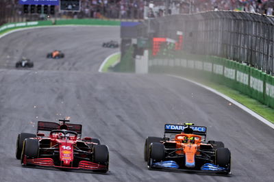 Charles Leclerc (MON) Ferrari SF-21 and Lando Norris (GBR) McLaren MCL35M battle for position.