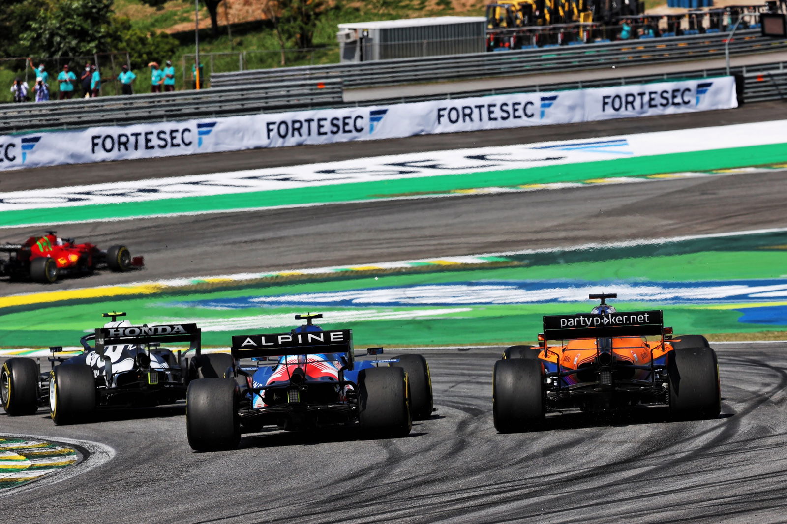 Esteban Ocon (FRA) Alpine F1 Team A521 and Daniel Ricciardo (AUS) McLaren MCL35M battle for position.