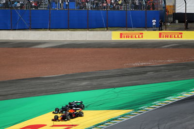 Max Verstappen (NLD) Red Bull Racing RB16B and Lewis Hamilton (GBR) Mercedes AMG F1 W12 battle for the leads of the race.