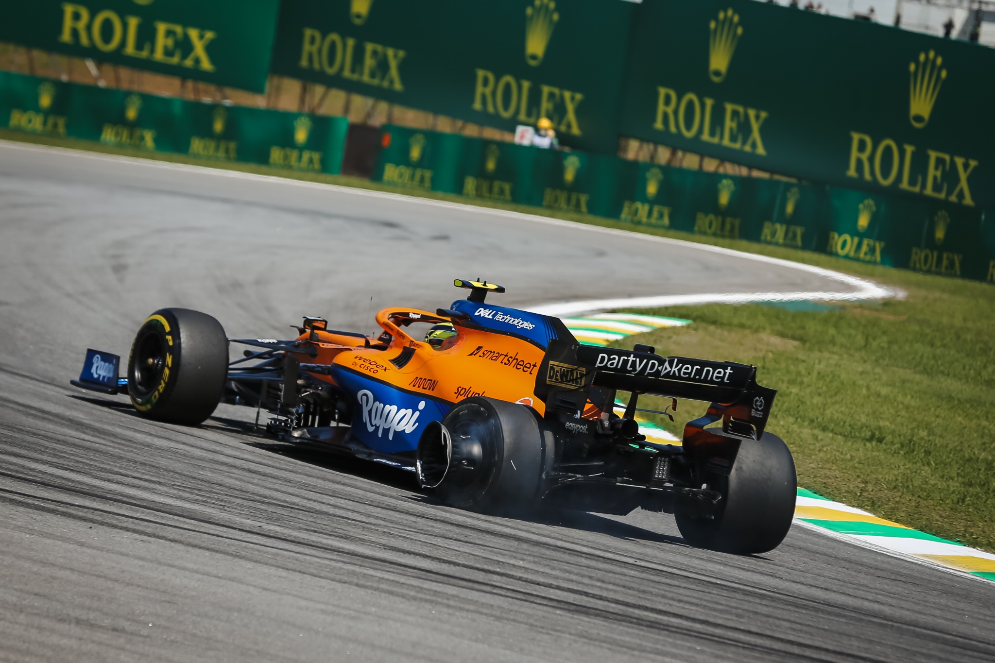 Lando Norris (GBR) McLaren MCL35M with a puncture at the start of the race.