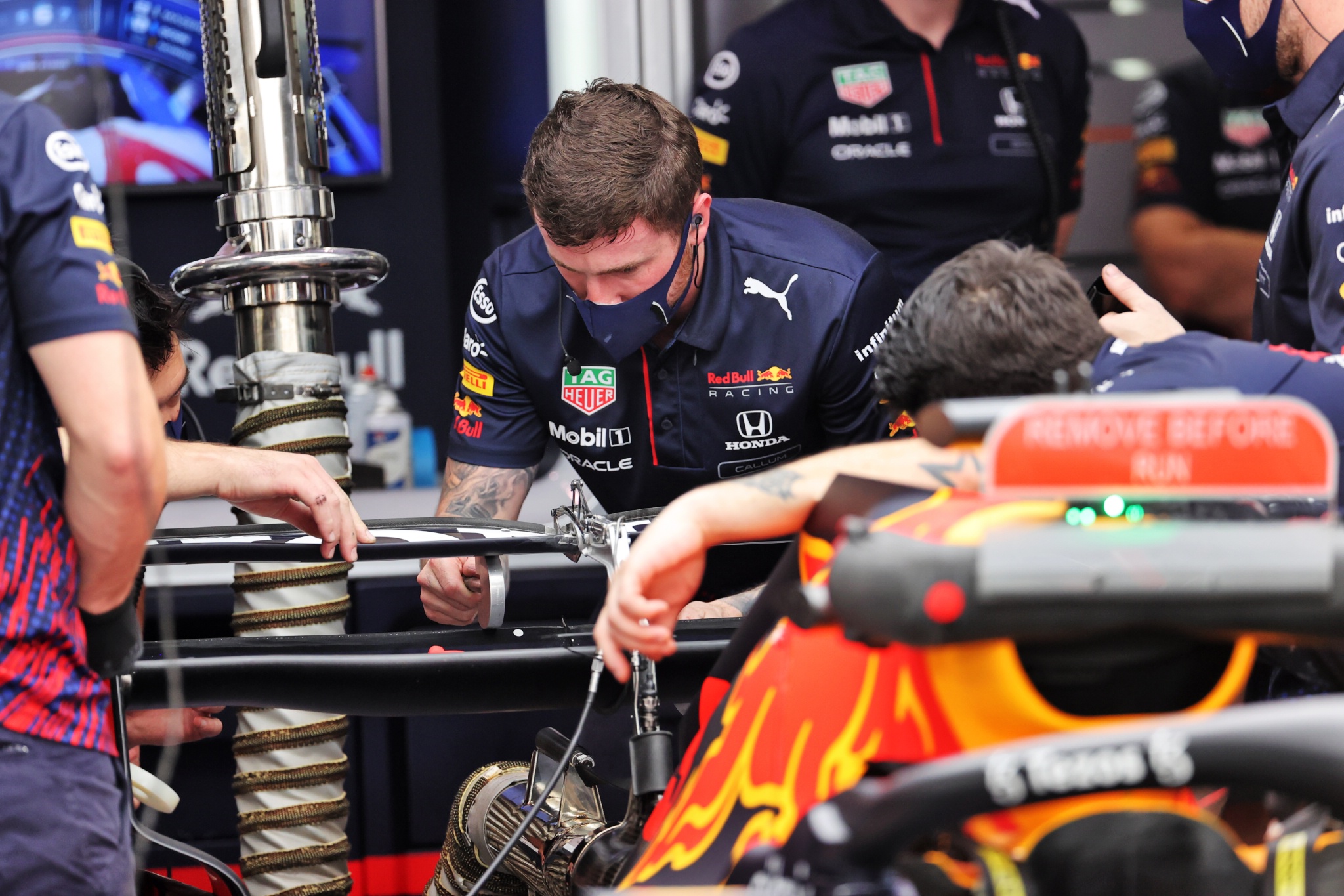 Red Bull Racing mechanics work on repairing the Red Bull Racing RB16B DRS rear wing actuator of Max Verstappen (NLD).